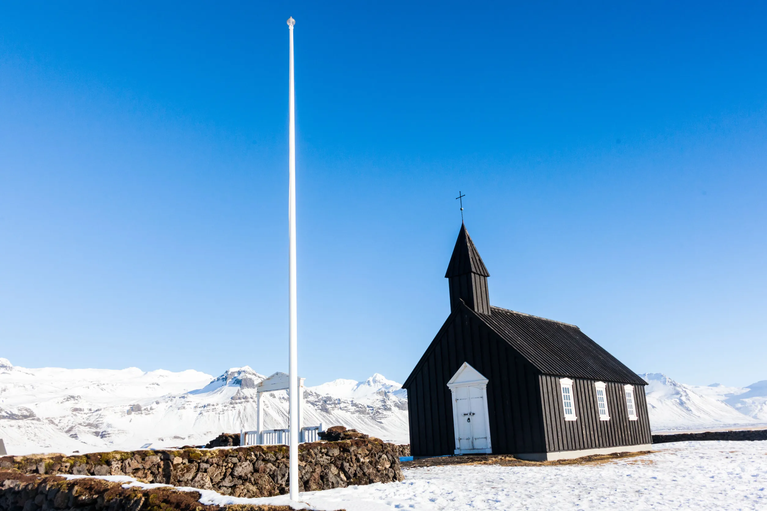 budakirkja or better known as the black church view with blue sky during