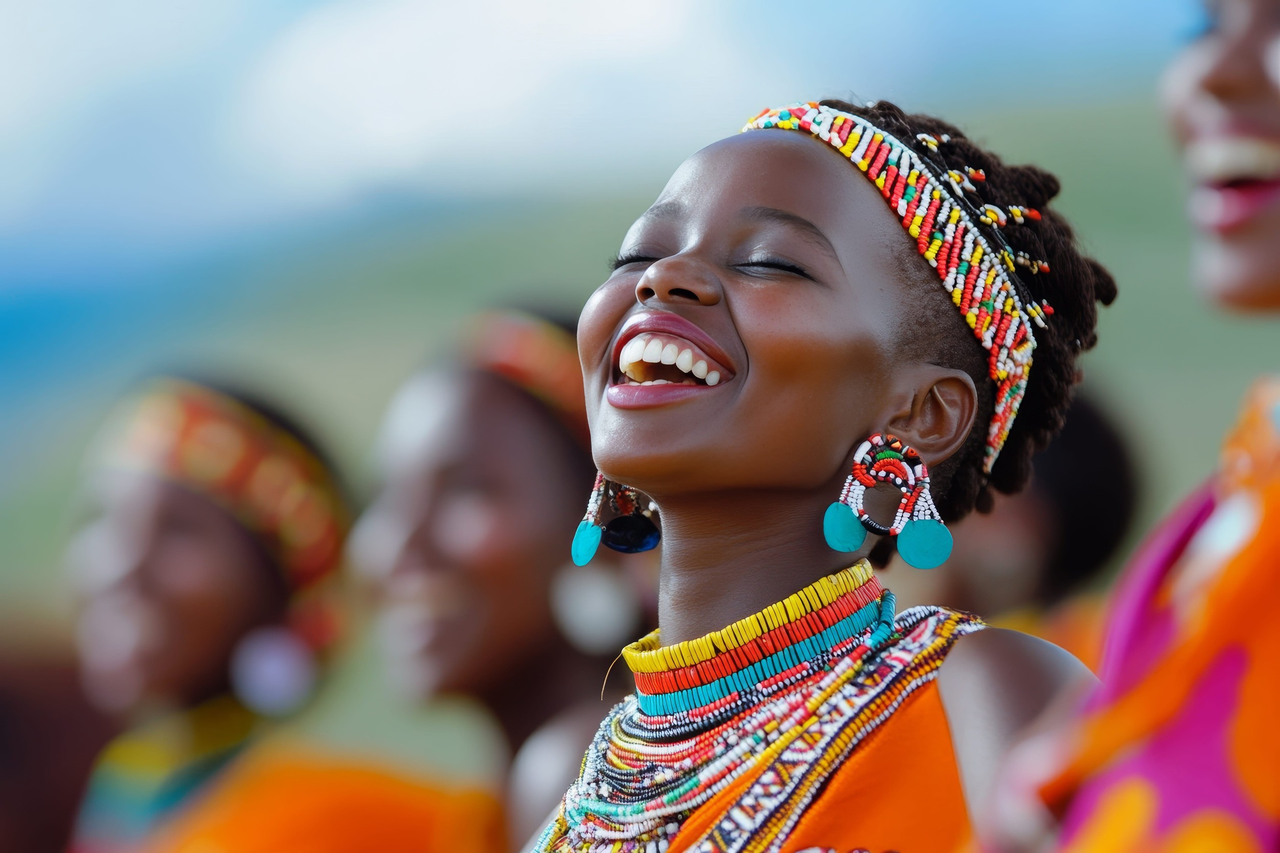 Joyful Celebration Of Young African Women In Traditional Attire